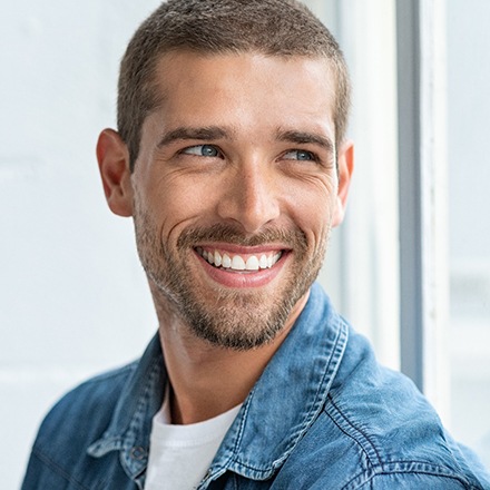man smiling after using clear aligners in Chicago