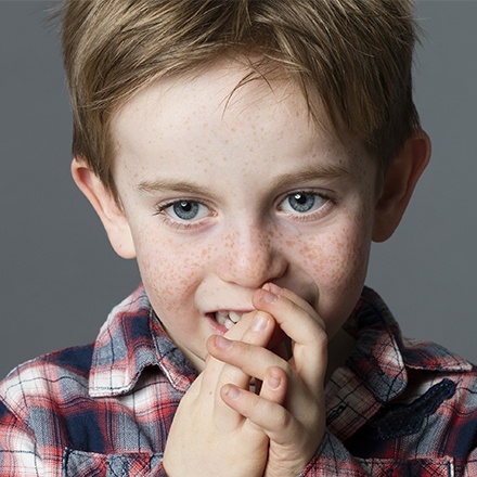 Child chewing on fingers