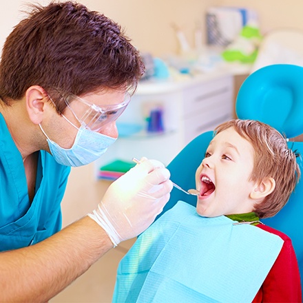 Little boy receiving dental exam