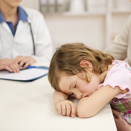 Little girl sleeping at school