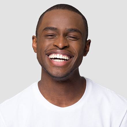 man smiling with Invisalign in Chicago