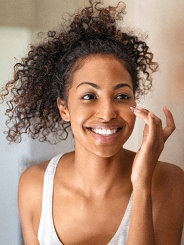 woman smiling in the mirror