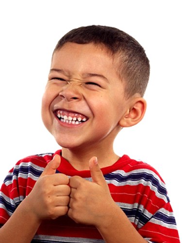 boy smiling with thumbs up