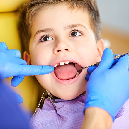 Young boy receiving dental exam