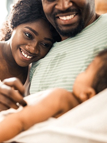 happy parents with their baby