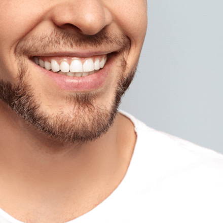 man smiling after getting answers to questions about InBrace lingual braces in South Loop