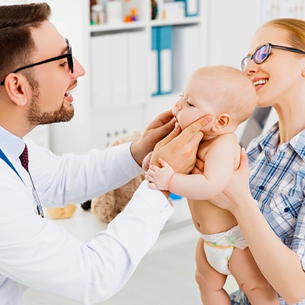 Dentist checking baby's teeth