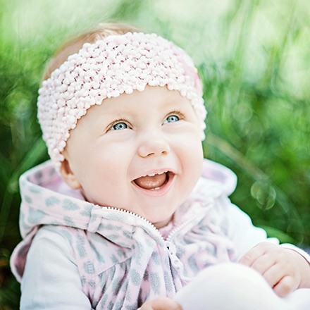 Smiling baby girl outdoors