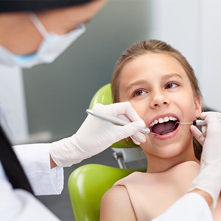 Child receiving dental exam