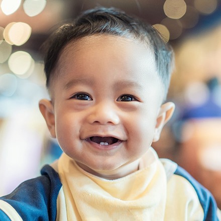 baby smiling after laser frenectomy