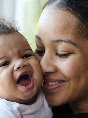 mom and baby smiling