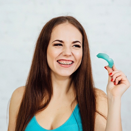 woman smiling braces mouthguard
