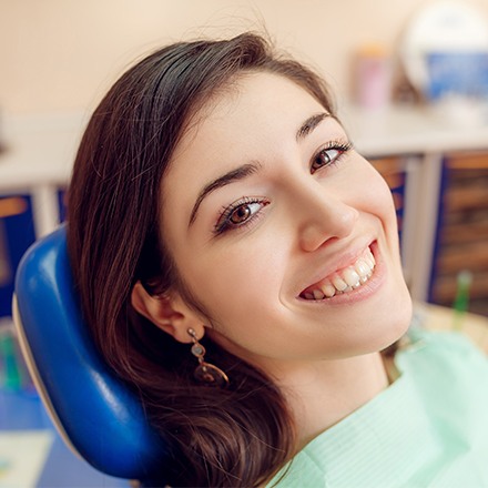 Teen girl smiling in dental chair