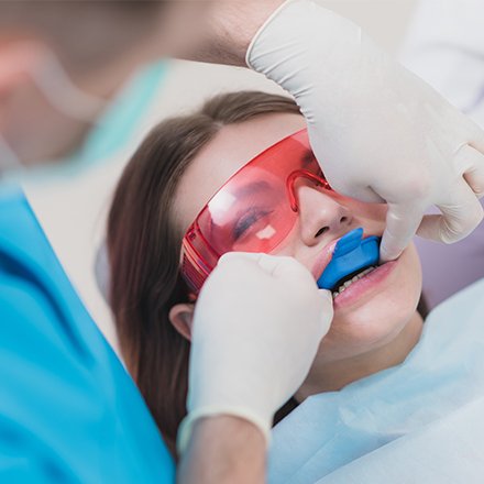 Young girl receiving fluoride treatment