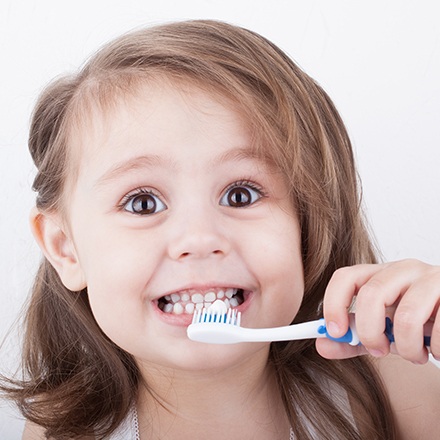 Little girl brushing teeth