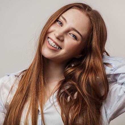 woman smiling with ceramic braces in South Loop