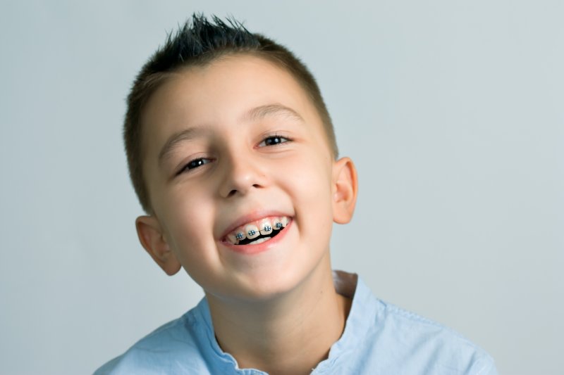 A child with braces after an Interproximal Reduction treatment
