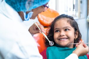 Child being examined by dentist. 