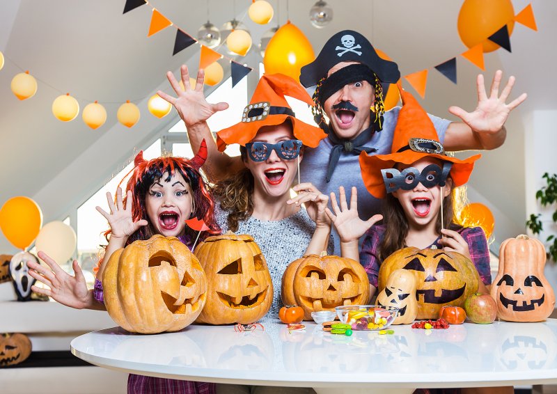 Clear aligners patient smiling with family in costume